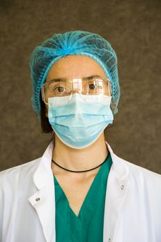 Woman doctors portrait, doctors with mask, glasses, glove and uniform. Uniform for surgery and pandemic.