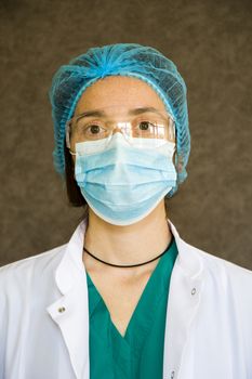 Woman doctors portrait, doctors with mask, glasses, glove and uniform. Uniform for surgery and pandemic.