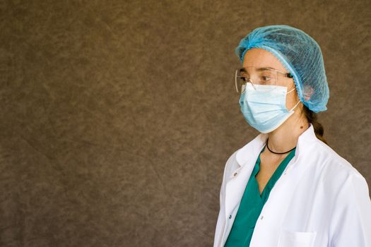 Woman doctors portrait, doctors with mask, glasses, glove and uniform. Uniform for surgery and pandemic.