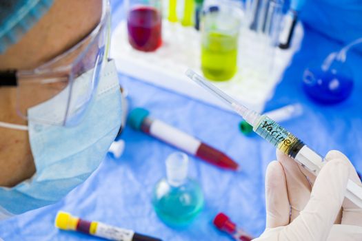 Doctors and needle, vaccination, antibiotic and immunization. Woman in uniform and needle with hand.