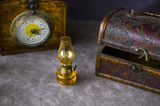Vintage objects on the table, old box and lamp