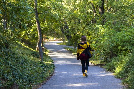 Woman in the botanic garden and park, trees and casual young girl portrait in garden