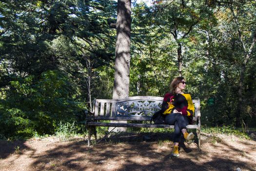 Woman in the botanic garden and park, trees and casual young girl portrait in garden