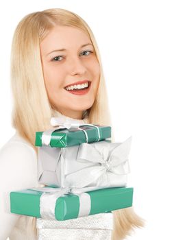 Happy woman holding Christmas gifts, white background with copyspace, shopping and holidays