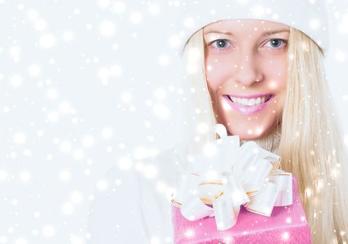 Happy woman holding Christmas gifts, silver background and snow glitter with copyspace, shopping and holidays