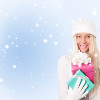 Happy woman holding Christmas gifts, blue background and snow glitter with copyspace, shopping and holidays