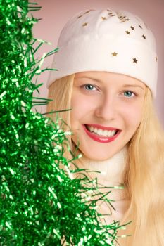 Cheerful blonde girl in Christmas time, woman with positive emotion in winter season for shopping sale and holiday brands