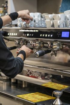 terni,italy october 20 2020:barista preparing coffee at the machine