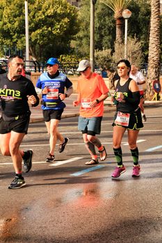 Santa Pola, Spain- January 20, 2019: Runners in the Half Marathon of the fishing village of Santa Pola, province of Alicante, on a sunny day in January
