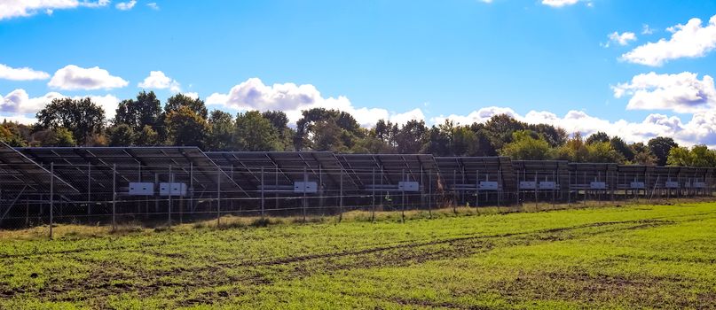 Generating clean energy with solar modules in a big park in northern Europe.