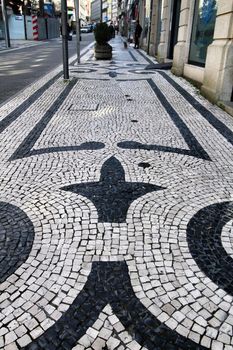Oporto, Portugal- January 1, 2020: Beautiful Cobblestone street called Santa Catarina in Oporto, Portugal in winter
