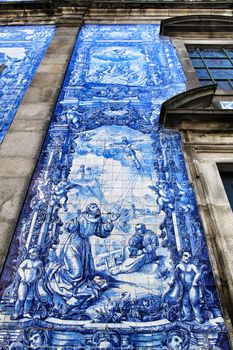 Oporto, Portugal- January 2, 2020: Beautiful and old tiled facade of Capela das Almas church in Oporto, Portugal