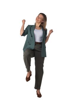 Young business woman winner holding fists isolated on white background full length studio portrait