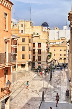 Elche, Alicante, Spain- September 12, 2020: People walking through Eucharistic Convent Square in Elche, Alicante in a sunny day of summer