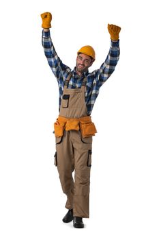 Young contractor worker in coveralls and hardhat with raised arms isolated on white background full length studio portrait