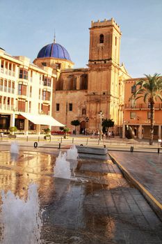 Elche, Alicante, Spain- September 12, 2020: People walking through Eucharistic Convent Square in Elche, Alicante in a sunny day of summer