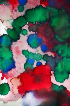 Ink drops on the paper, red, green and blue ink splashes background, painting and drawing