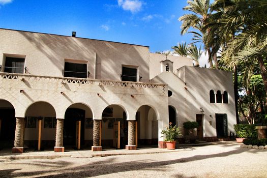 Elche, Alicante, Spain- February 14, 2019: Old house with hermitage in the Huerto del Cura Garden in winter