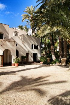 Elche, Alicante, Spain- February 14, 2019: Old house with hermitage in the Huerto del Cura Garden in winter