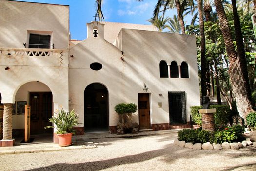Elche, Alicante, Spain- February 14, 2019: Old house with hermitage in the Huerto del Cura Garden in winter