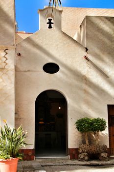 Elche, Alicante, Spain- February 14, 2019: Old house with hermitage in the Huerto del Cura Garden in winter