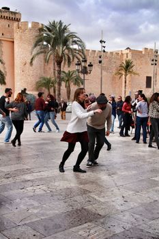 Elche, Alicante, Spain- February 19, 2019: People enjoying and dancing swing in the street in winter
