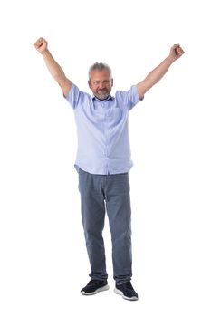 Senior business man winner with raised arms isolated on white background full length studio portrait
