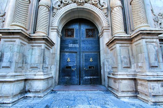 Elche, Alicante, Spain- September 9, 2020: Main entrance and beautiful Valencian baroque facade of Santa Maria church dedicated to the Lady of the Assumption