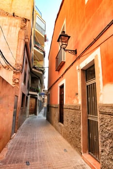Elche, Alicante, Spain- September 9, 2020: Streets, majestic facades, windows and balconies of Elche city. Alicante province, Spain.
