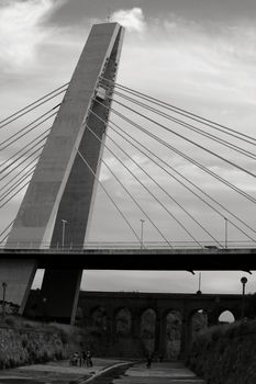 Elche, Alicante, Spain- September 13, 2020: Pont de la Generalitat under cloudy sky next to the Vinalopo River in Elche