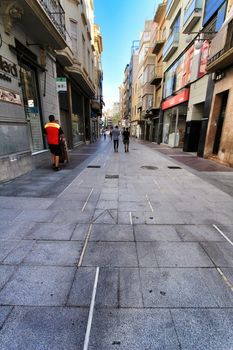 Elche, Alicante, Spain- October 7, 2020: Pedestrian street called Corredora plenty of shops in the center of the city of Elche in the morning