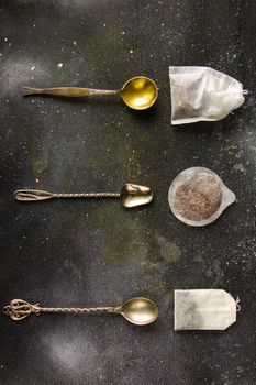 Set of tea on the vintage silver spoons, various of tea and teabags