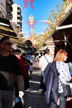Jijona, Alicante, Spain- December 9, 2018: People walking and buying traditional nougat at the Jijona Christmas Fair