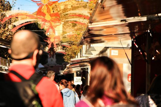 Jijona, Alicante, Spain- December 9, 2018: People walking and buying traditional nougat at the Jijona Christmas Fair