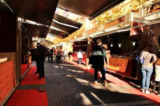 Jijona, Alicante, Spain- December 9, 2018: People walking and buying traditional nougat at the Jijona Christmas Fair