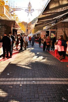 Jijona, Alicante, Spain- December 9, 2018: People walking and buying traditional nougat at the Jijona Christmas Fair