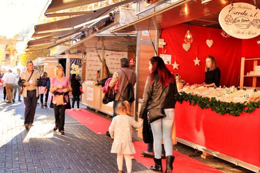 Jijona, Alicante, Spain- December 9, 2018: People walking and buying traditional nougat at the Jijona Christmas Fair