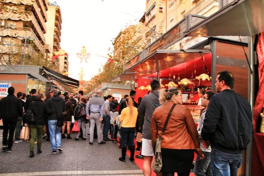 Jijona, Alicante, Spain- December 9, 2018: People walking and buying traditional nougat at the Jijona Christmas Fair