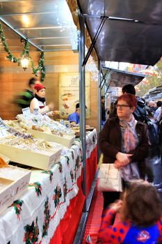 Jijona, Alicante, Spain- December 9, 2018: People walking and buying traditional nougat at the Jijona Christmas Fair