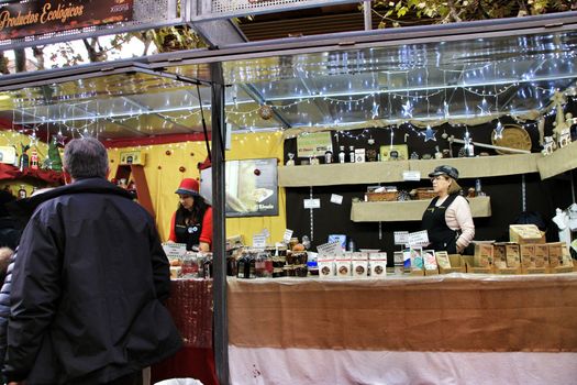 Jijona, Alicante, Spain- December 9, 2018: People walking and buying traditional nougat at the Jijona Christmas Fair