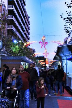 Jijona, Alicante, Spain- December 9, 2018: People walking and buying traditional nougat at the Jijona Christmas Fair