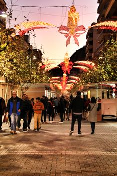 Jijona, Alicante, Spain- December 9, 2018: People walking and buying traditional nougat at the Jijona Christmas Fair