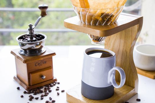 Coffee grinder, maker, cup and beans, morning coffee, energy drink