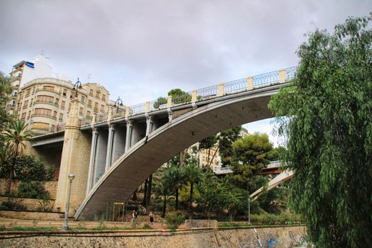 Elche, Alicante, Spain- November 16, 2018 - Landscape of the hillside of the Vinalopo River in Elche with its bridges and green vegetation after a rainy day of Autumn