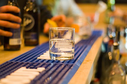 cocktail in bar, alcoholic drink in glass, ace and alcohol background.