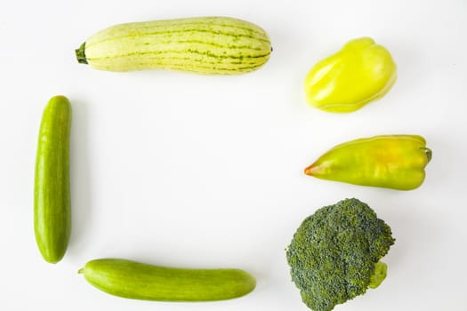 Green vegetables on the white background, high angle view