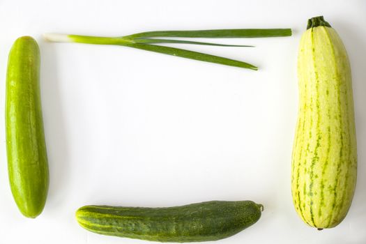 Green vegetables on the white background, high angle view