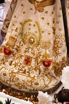 Elche, Alicante, Spain- December 29, 2019: Beautiful coat of the Virgin of the Assumption embroidered in gold