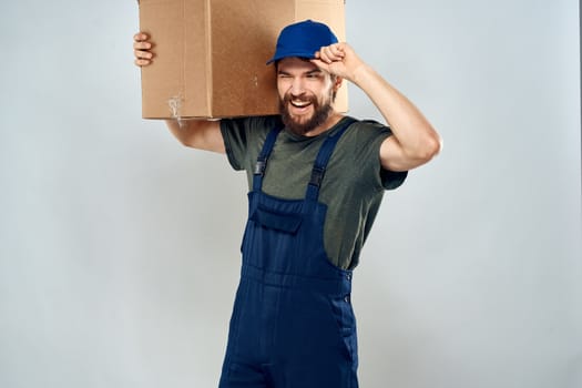 Male worker loading delivery boxes in hands packing lifestyle. High quality photo
