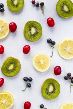 Currant, Cornus and dogberry, lemon and kiwi close-up, food photography